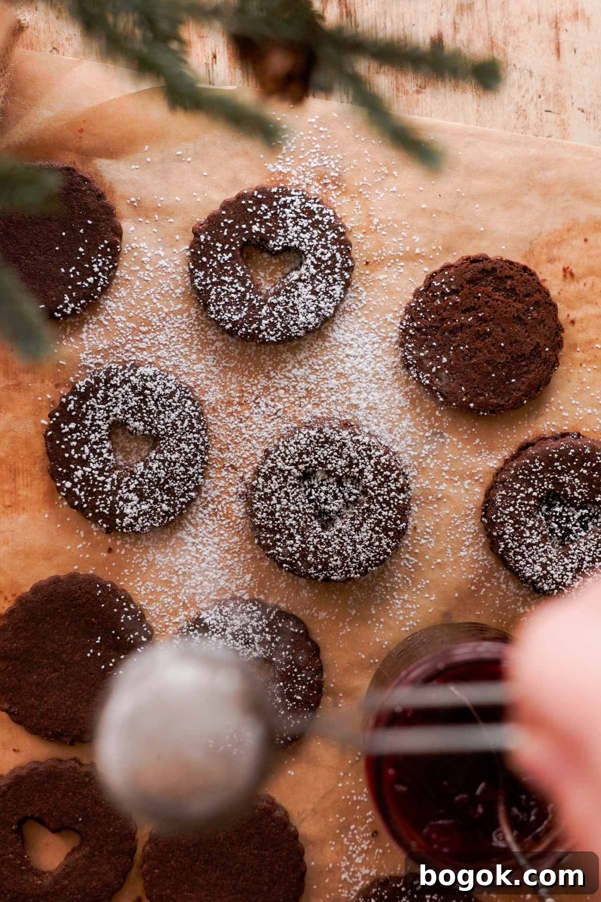 Chocolate Almond Cherry Linzer Cookies Recipe 13 dusting chocolate almond linzer cookies with powdered sugar