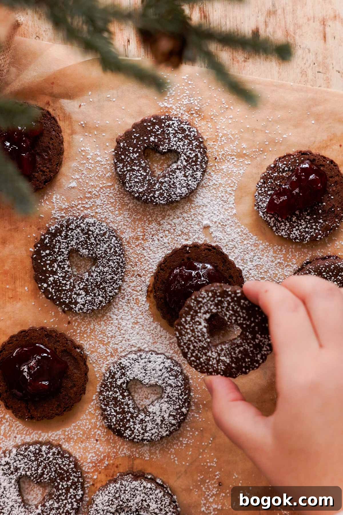 Chocolate Almond Cherry Linzer Cookies Recipe 14 assembling chocolate cookies with cherry filling