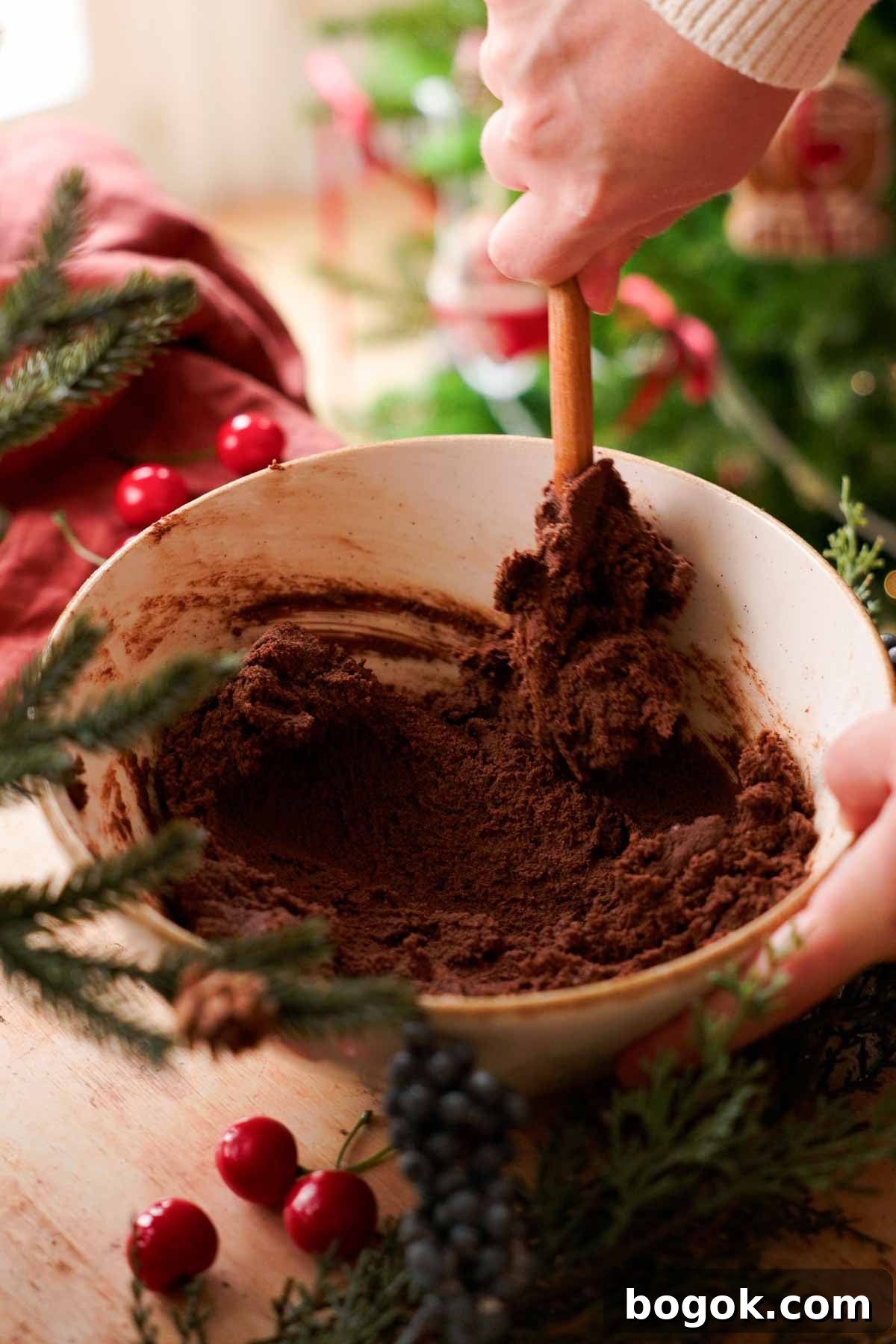 Chocolate Almond Cherry Linzer Cookies Recipe 8 stirring chocolate almond cookie dough with wooden spoon