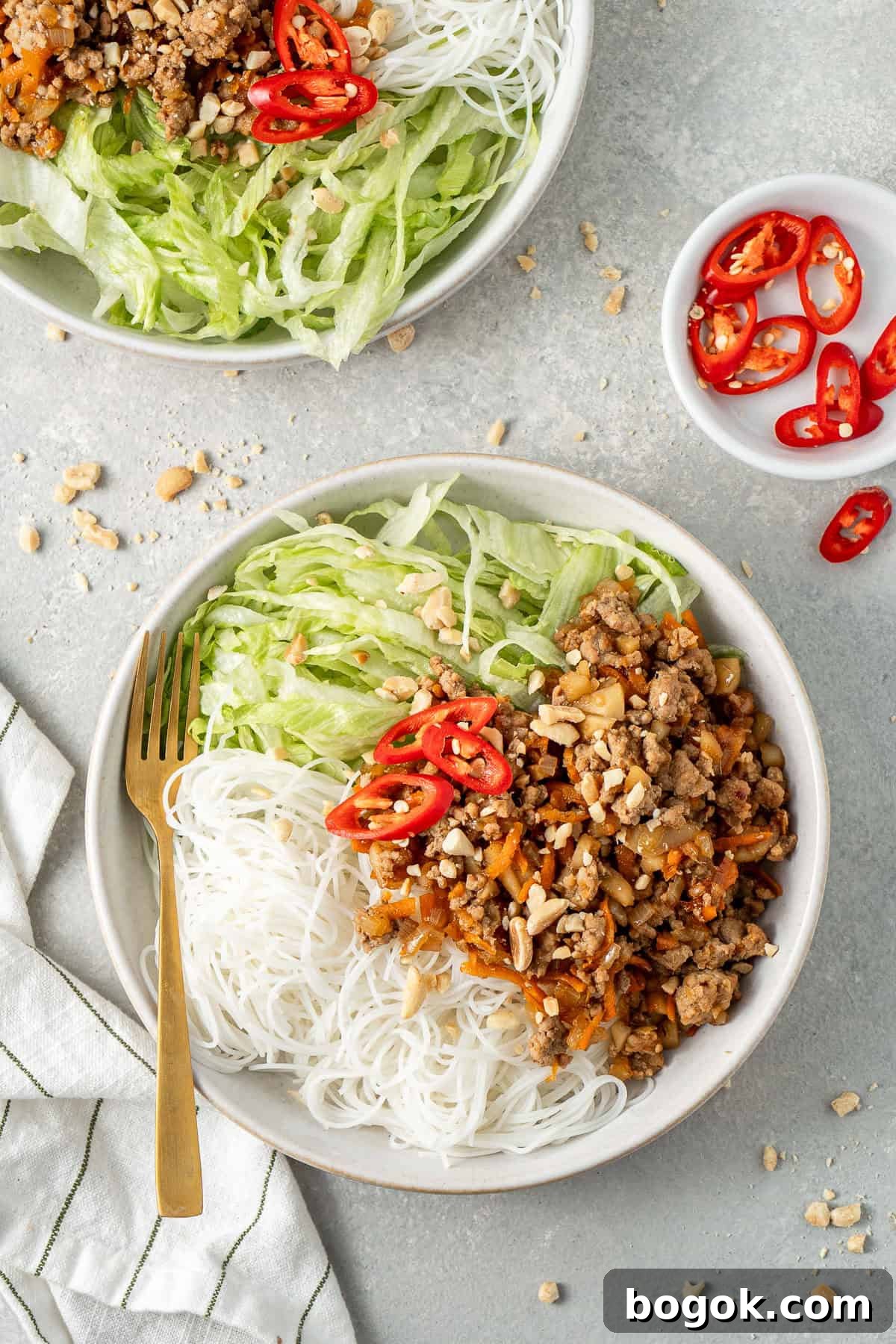 San Choy Bow Lettuce Wrap Bowls - Chinese Pork Recipe 2 San choy bowl bowls with noodles, lettuce and fresh chilli.