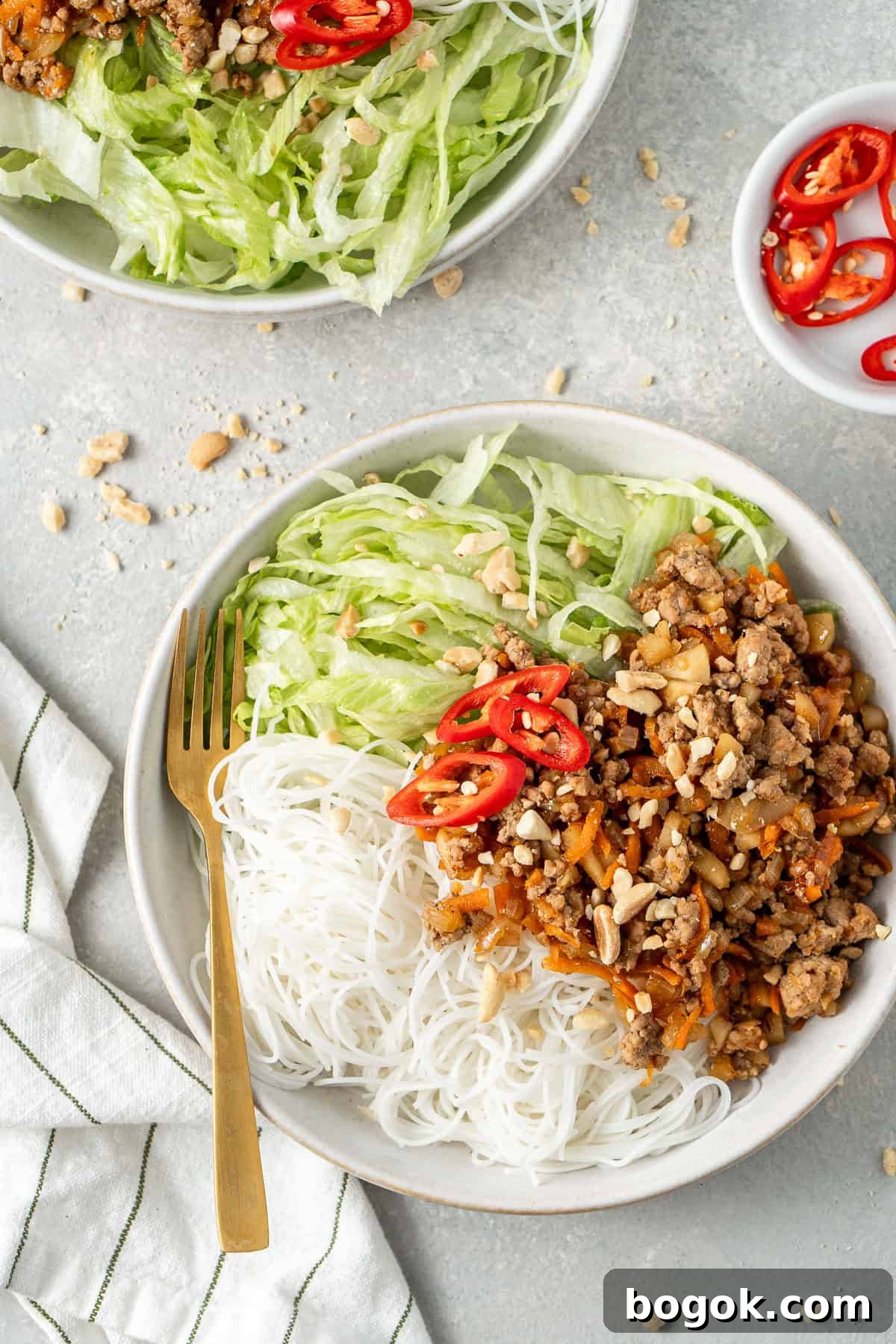 San Choy Bow Lettuce Wrap Bowls - Chinese Pork Recipe 10 San choy bowl bowls with noodles and lettuce.
