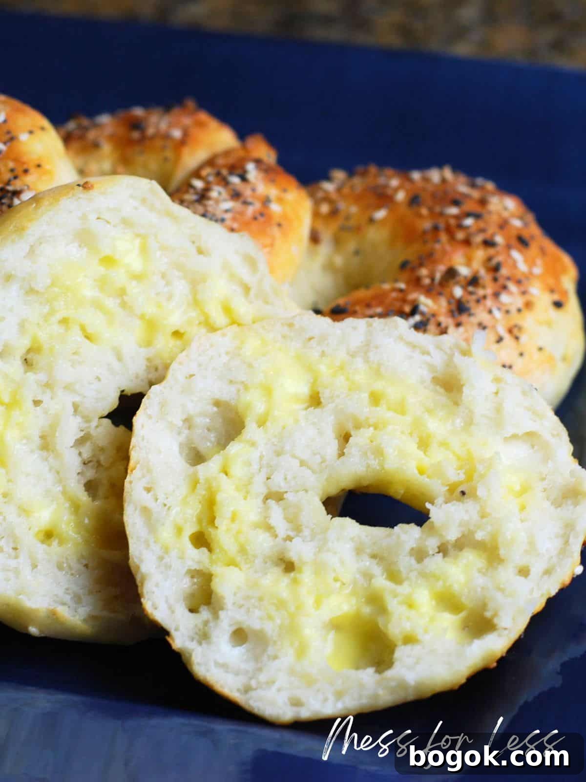 Freshly baked bagels on a blue plate