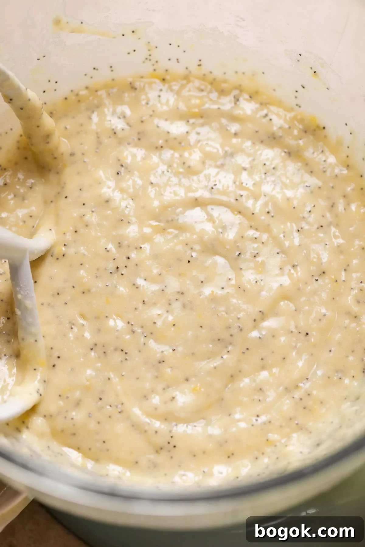 A mixing bowl with the lemon poppy seed cake batter.