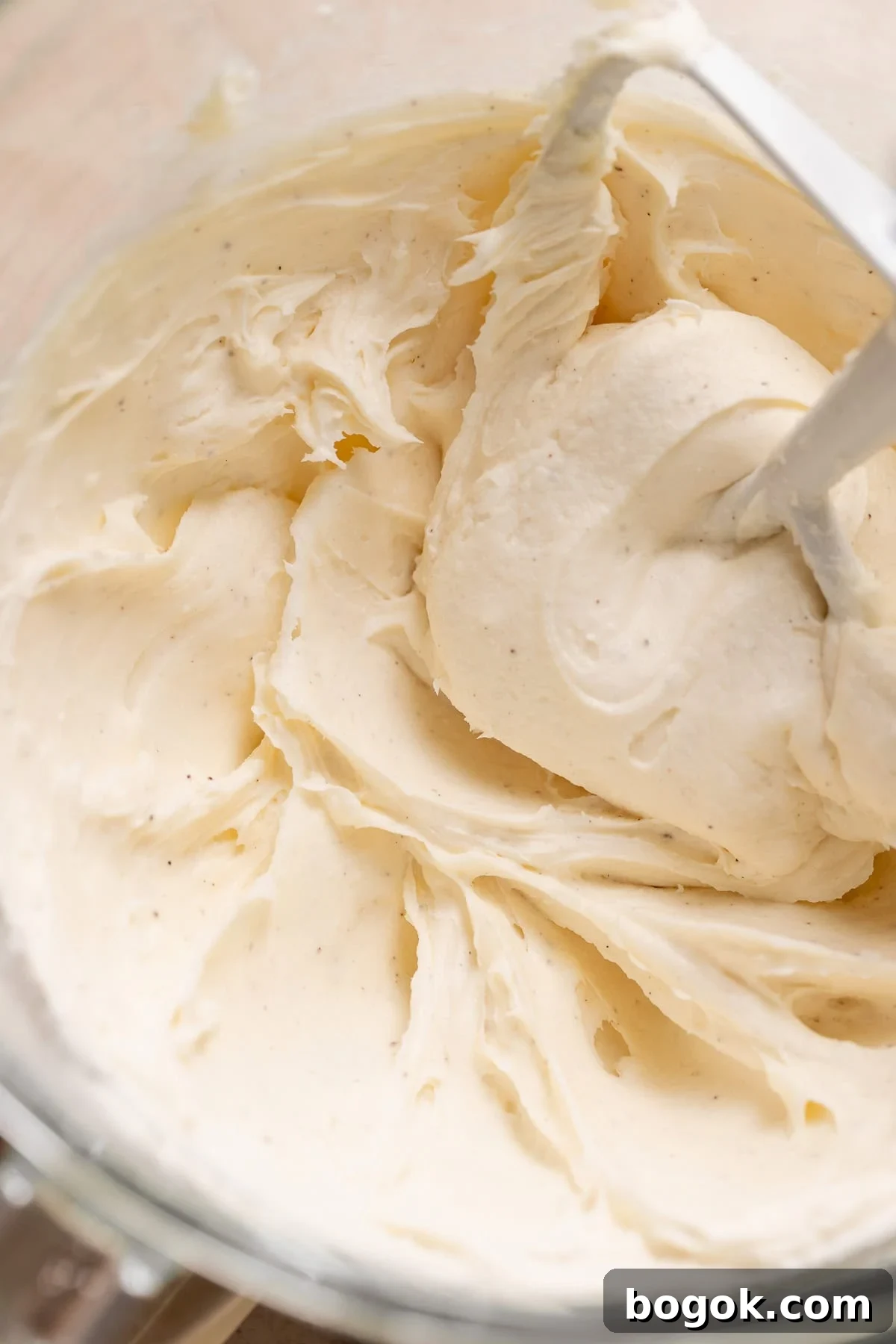 Cream cheese frosting in a mixing bowl.