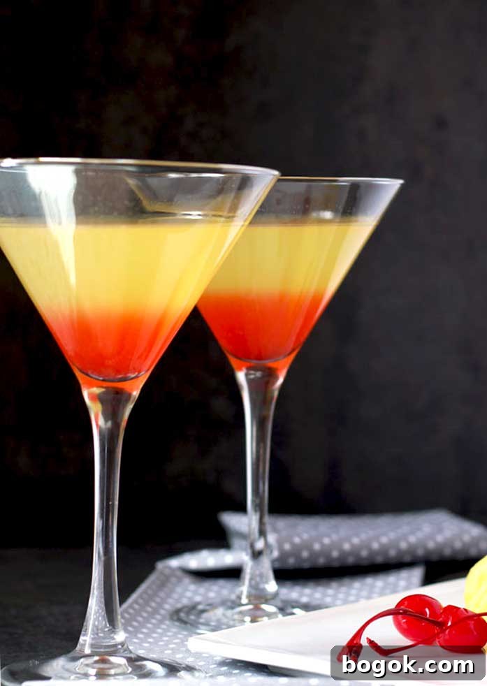 Bikini Martini Recipe: Pineapple Vodka Cocktail 2 Two martini glasses filled with colorful Bikini vodka martini