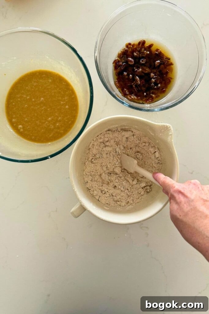 Mixing the dry ingredients to make sourdough date and walnut loaf cake.