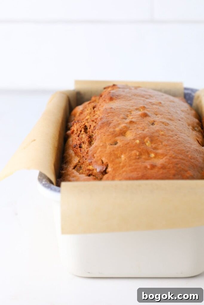 Sourdough date and walnut loaf cake fresh baked in loaf pan.