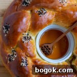 Last-Minute Rosh Hashanah Prep Guide 21 Round challah with a honey ramekin in the center.