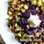 Last-Minute Rosh Hashanah Prep Guide 30 roasted brussels sprouts with yogurt topping and purple cauliflower on a white plate