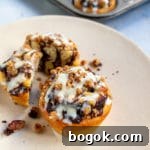 Last-Minute Rosh Hashanah Prep Guide 37 Chocolate Babka mini on tan plate - one whole and one cut in half.
