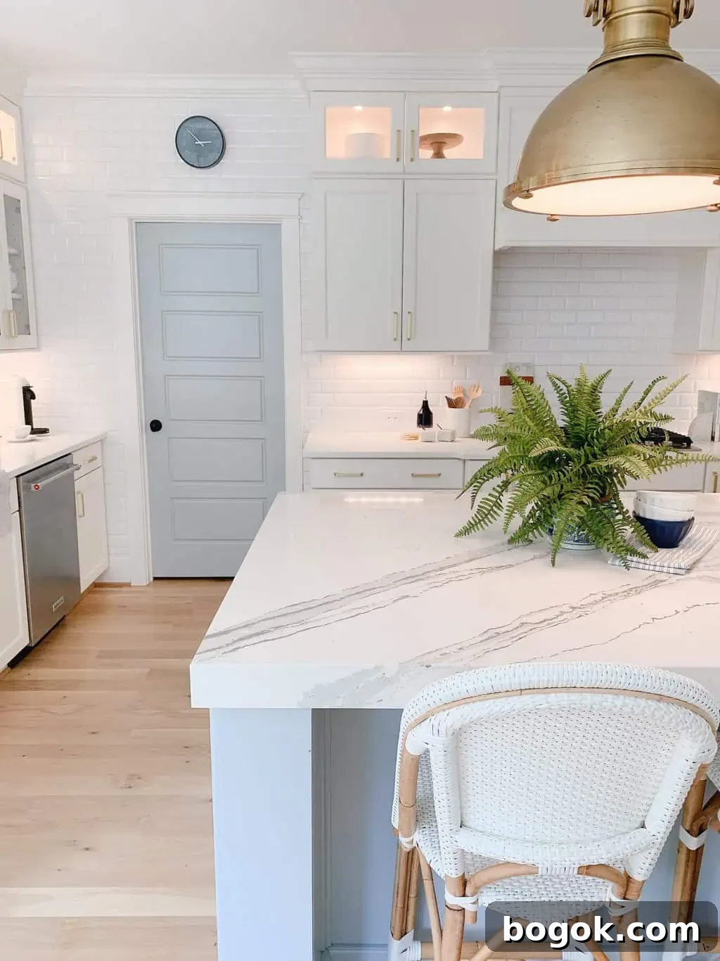 White Kitchen with Blue Island: Design Details 11 Cambria Brittanicca Quartz on kitchen