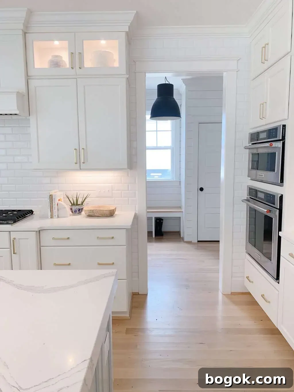 White Kitchen with Blue Island: Design Details 12 subway tile in a blue and white kitchen