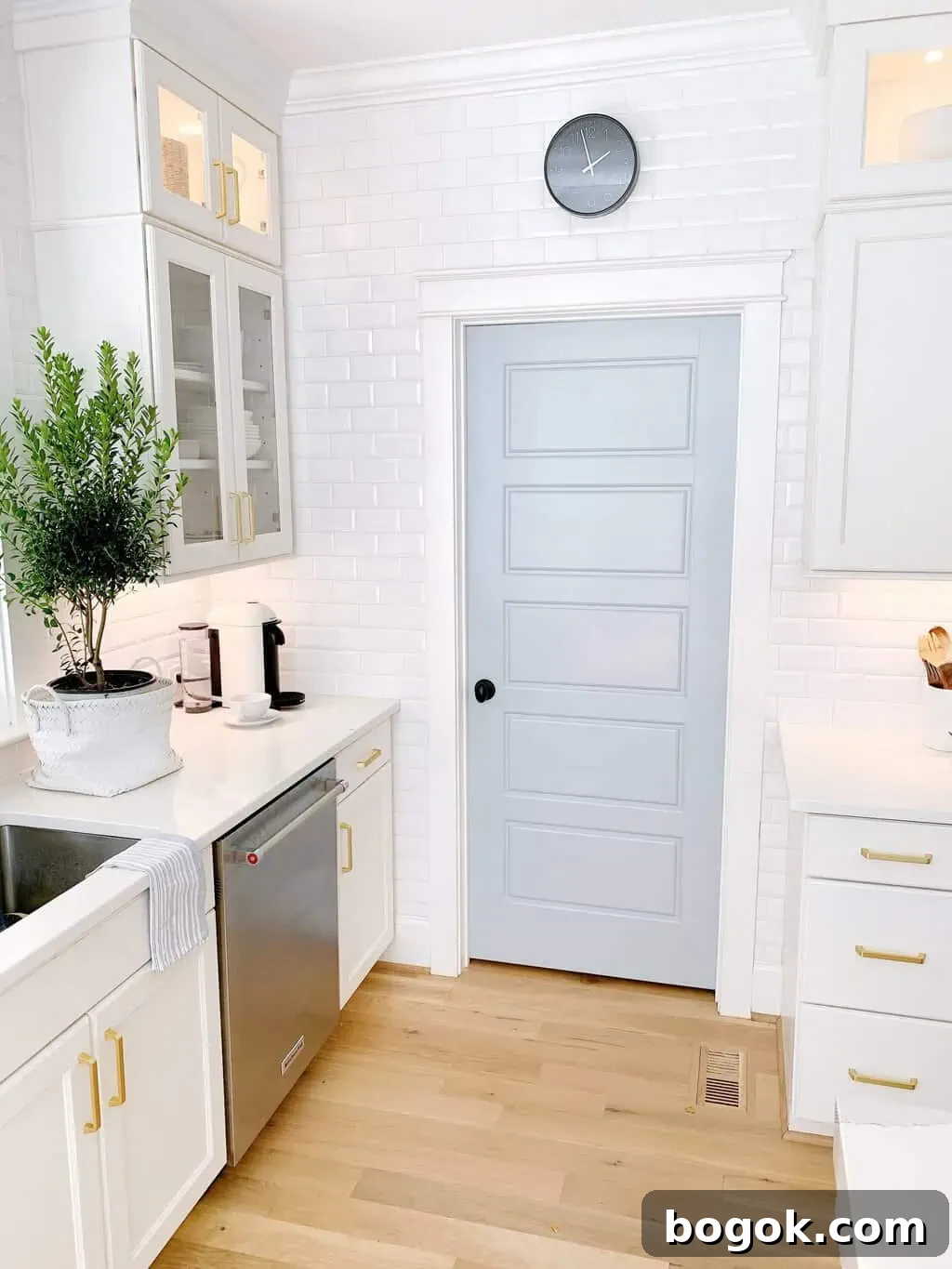 White Kitchen with Blue Island: Design Details 13 a blue pantry door in a white kitchen