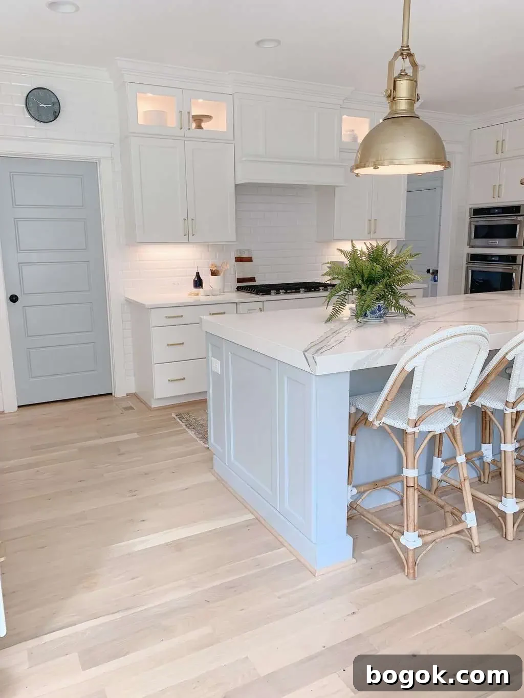 White Kitchen with Blue Island: Design Details 15 range hood in a blue and white kitchen