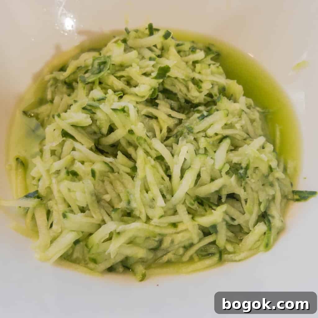 Authentic Greek Tzatziki Sauce Recipe 5 Step 2 Squeeze water out of salted grated cucumber