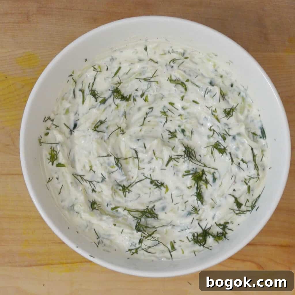 Authentic Greek Tzatziki Sauce Recipe 7 Step 4 mix all ingredients in a bowl and top tzatziki sauce with dill