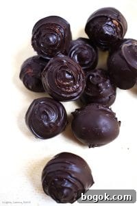 Tim Tam Cheesecake Truffles Recipe - No-Bake Bite-Sized Treats 4 Chocolate covered Tim Tam Cheesecake Truffles. These are sweet and creamy Tim Tam cheesecake with the distinct flavour of chocolate Tim Tams. If you love Tim Tams and cheesecake you will love these truffles. #timtams #timtamcheesecake
