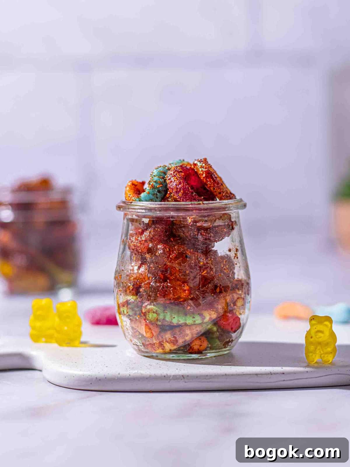 How to Make Mexican Chamoy Candy: Tangy Sweet Treat 7 dulce enchilados in a small jar.