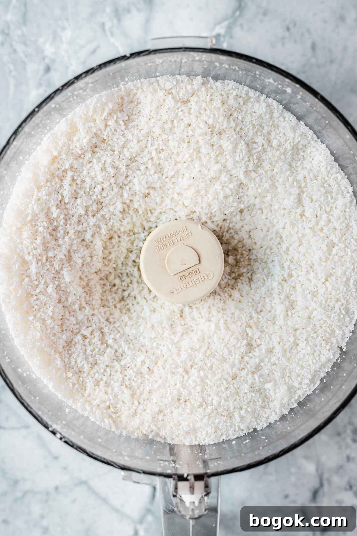 Classic Pink Coconut Ice Candy Recipe 7 Finely shredded coconut in a food processor.