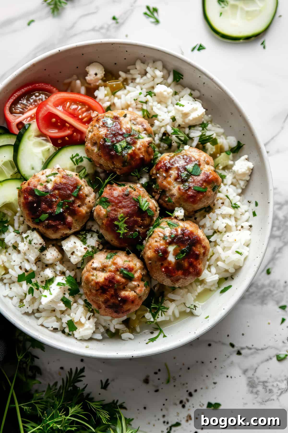 Greek-Style Chicken Meatballs with Lemon & Oregano 6 Greek chicken meatballs with feta and rice.